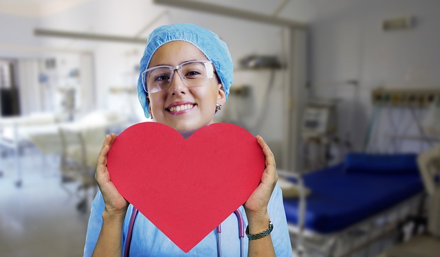 Doctor holding up the heart of the paper
