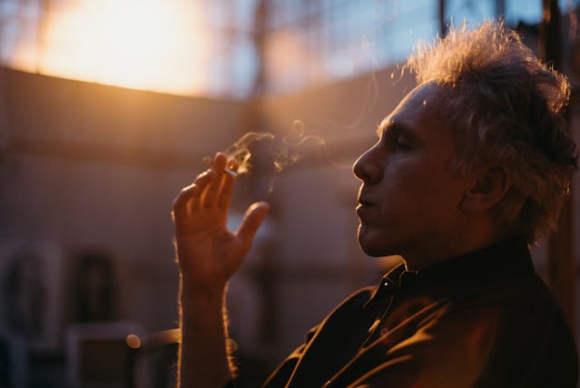 man smoking a cigarete