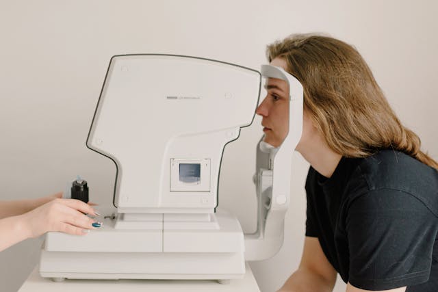 woman having her eyes testes by a doctor