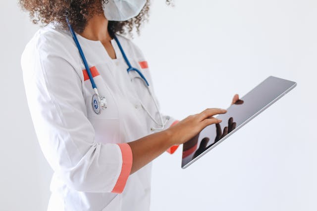 doctor holding tablet
