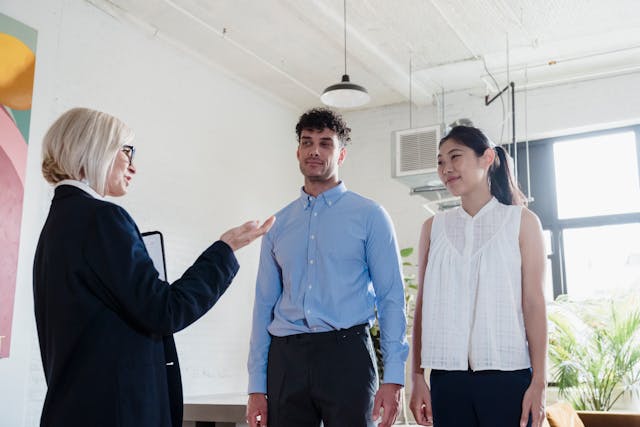 a doctor talking to a man and woman