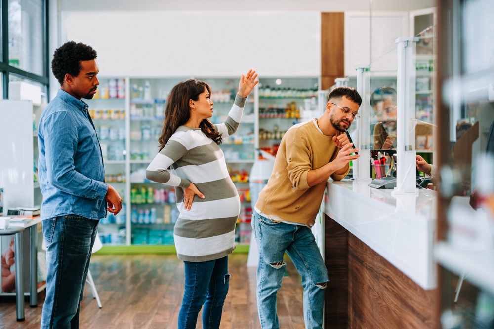 A pregnant woman is impatient and angry in a pharmacy line who has upset a customer before taking a trip to the pharmacy.