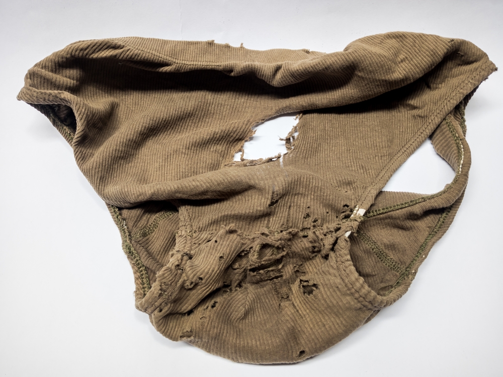 Men's broken underpants on a white background
