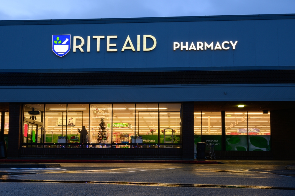 Issaquah, Wa, USA - December 10, 2023; View of Rite Aid Pharmacy in the lights in the window and in the asphalt shop