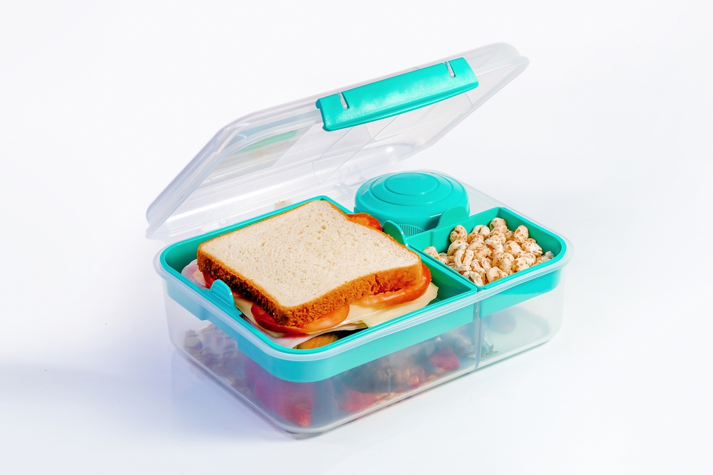 Colorful Lunchbox with Sandwich, Strawberries, and Cereal