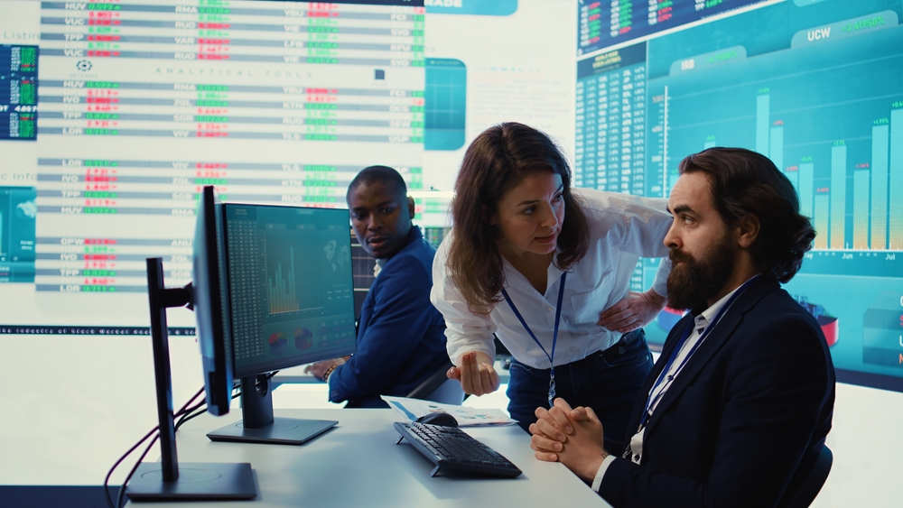 Irritated angry team leader screaming at her coworker after he failed to calculate expenditures, showing her disappointment in front of everyone. Furious dissatisfied business manager. Camera B.