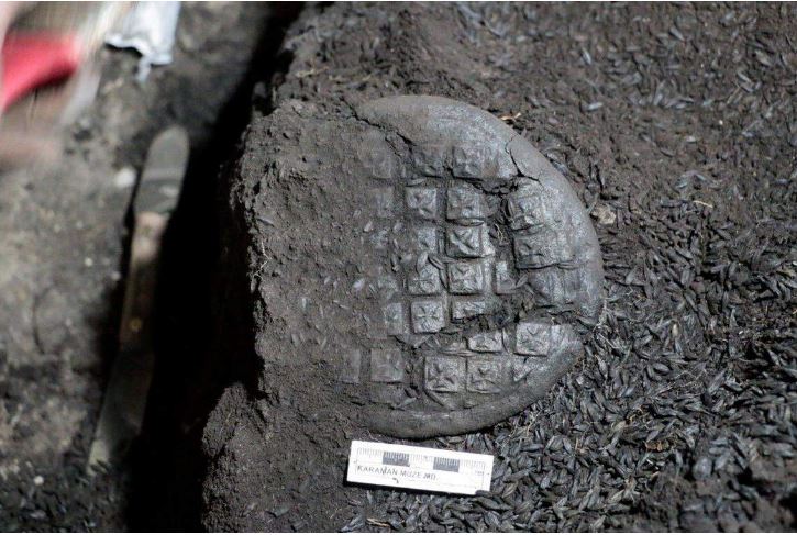 a bread loaf with cross design