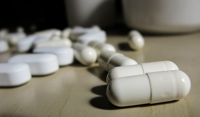 close up of white capsules on a table