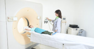 How Lego MRI Toys Are Making Medical Scans Less Scary for Children Child in MRI machine being attended to by medical professional