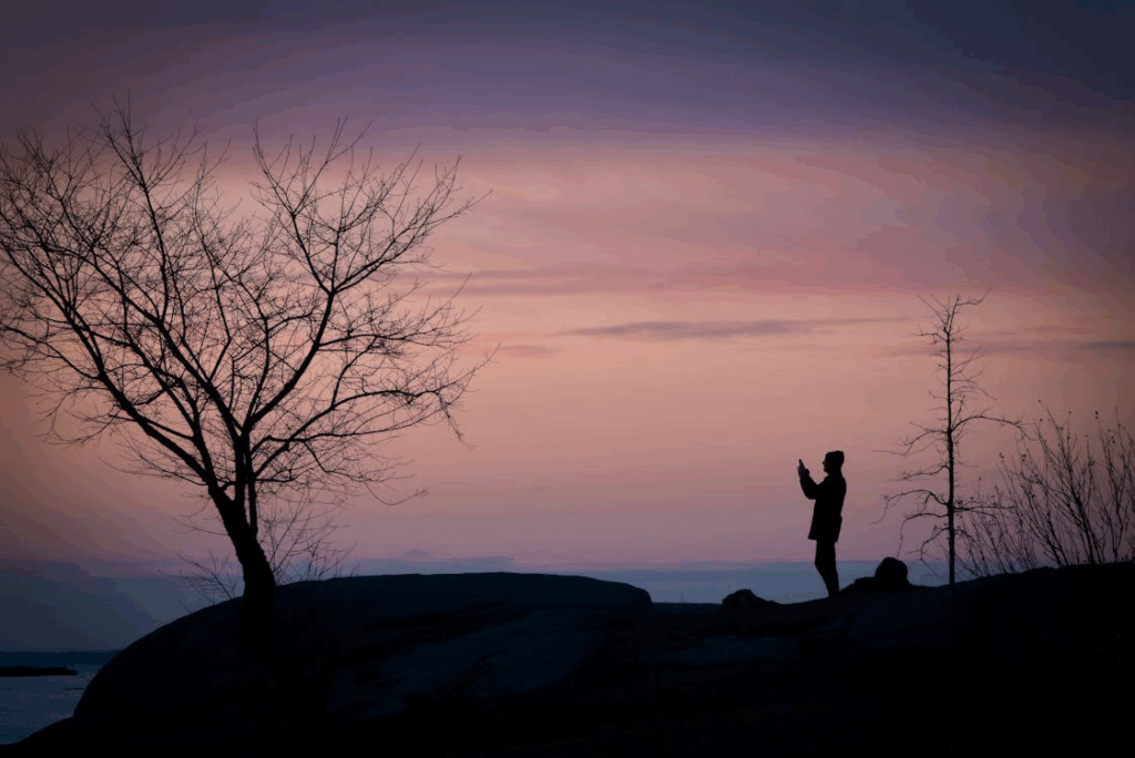 Silhouette of Lone Figure at Sunset