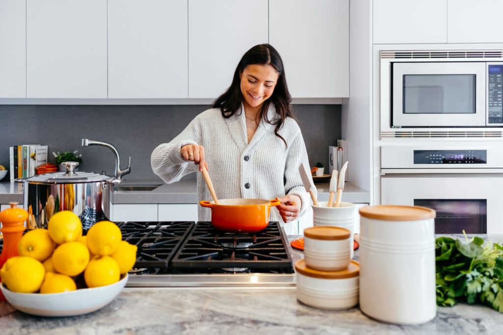 Woman cooking inside the kitchen room