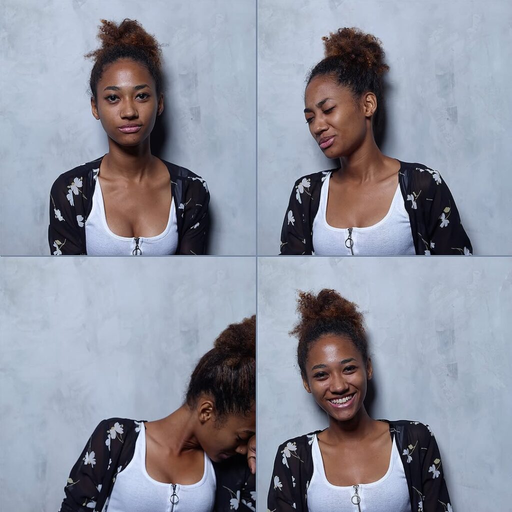 dark complexioned woman in black and white shirt smiling and showing expressions