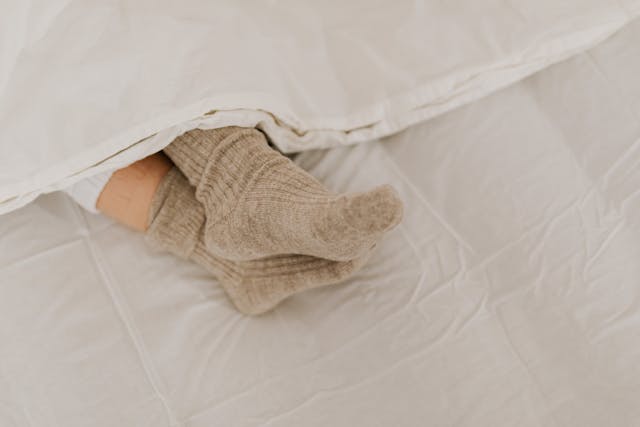 socks under a blanket