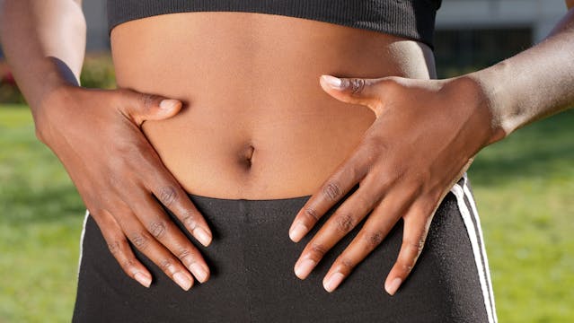 woman holding her stomach