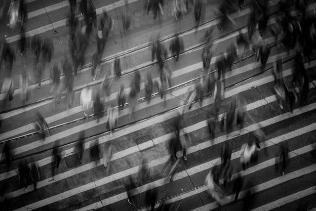 crowd of people crossing the road