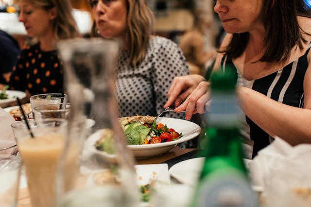 women eating salad