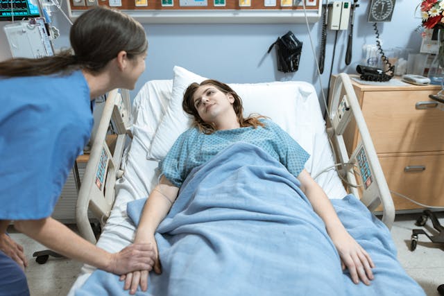 woman lying in hospital bed