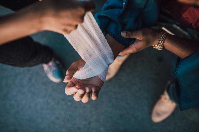 person's hand being wrapped up