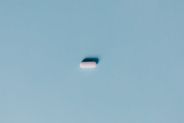 white pill on blue background