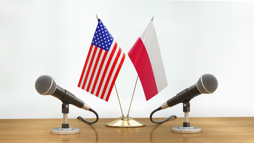 3d illustration. Microphones and flags pair on a desk over defocused background