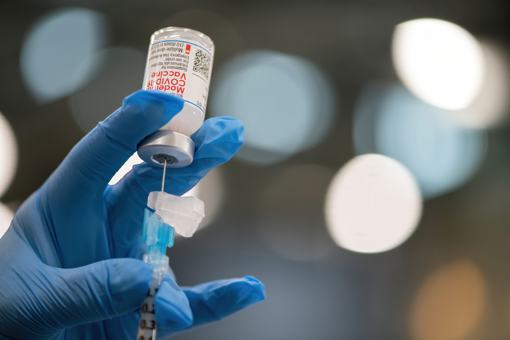 Grayslake, IL - January 30, 2021: Drive-through indoor COVID-19 vaccination facility at the Lake County Fairgrounds in Grayslake. The facility is dispensing both the Moderna and Pfizer vaccine.