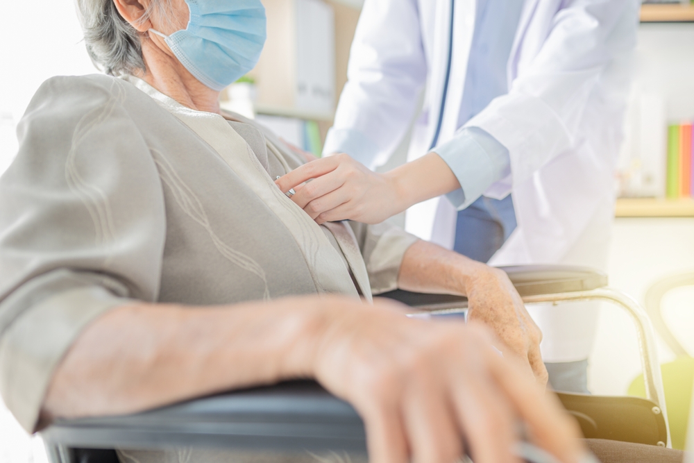 doctor use stethoscope listening lung of patient, elderly health check up, they wear surgical mask in hospital, respiratory disease protection