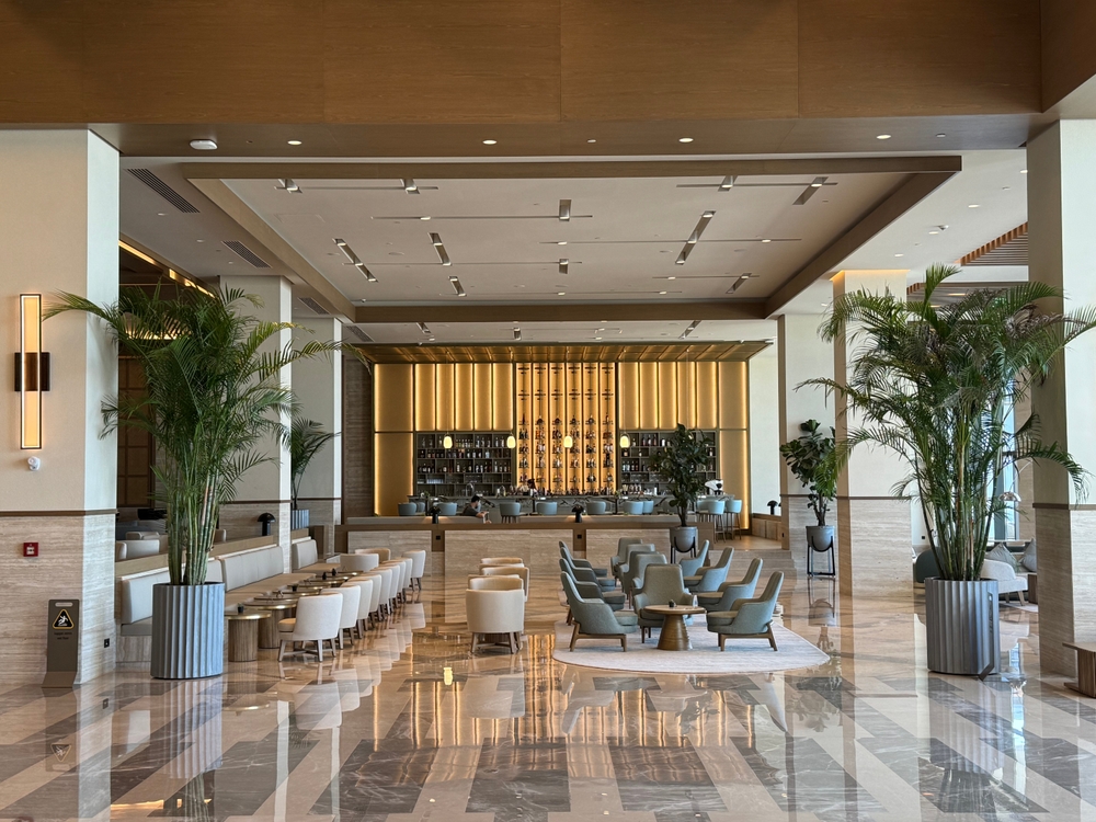 Didim, Turkey - August 5, 2024. The lobby bar of the luxury hotel Anda Barut - a modern interior style, geometric shapes and lines of designer furniture, flowers in large pots. Editorial use only.