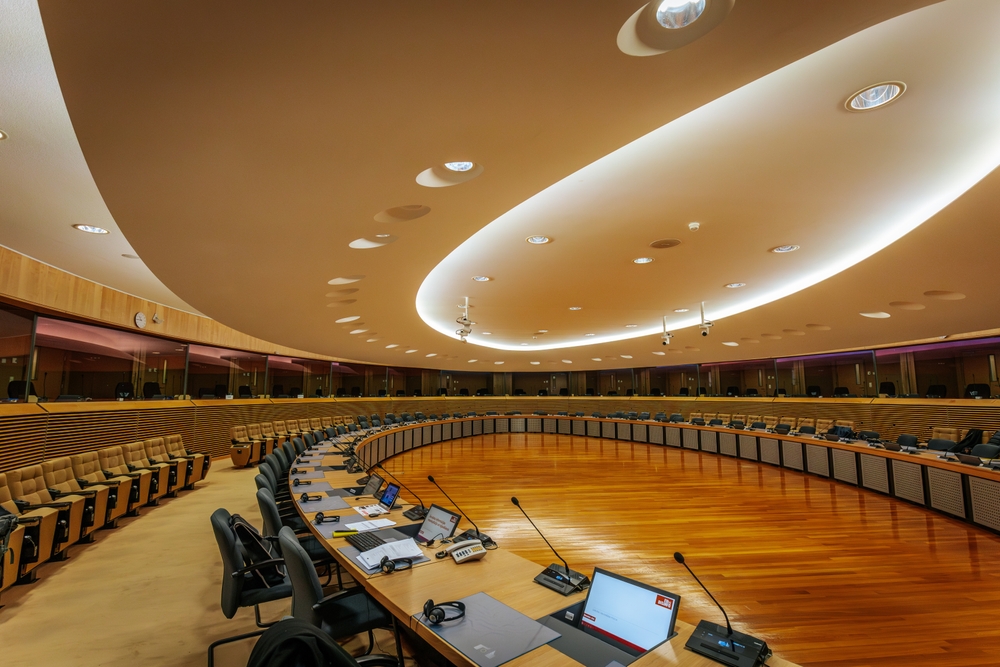 A modern European Commission conference room in Brussels, Belgium, with a circular layout, wooden flooring, integrated technology. 12.04.2024 Brussels, Belgium