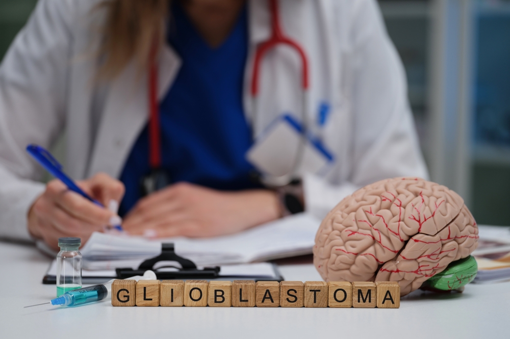 A doctor conducts an indepth study of glioblastoma using an advanced brain model alongside various medical tools