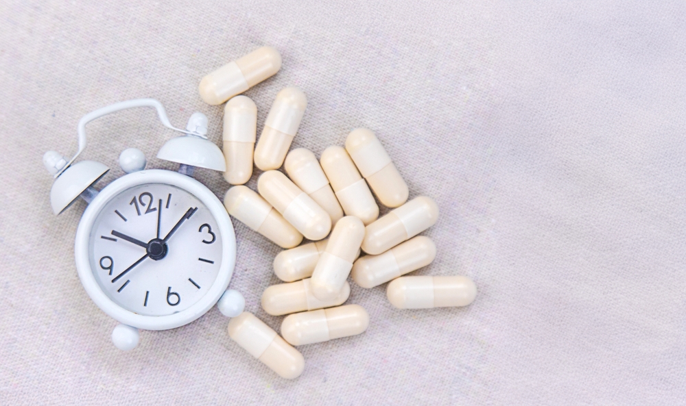 5-HTP sleep supplement capsules. Selective Focus. night.