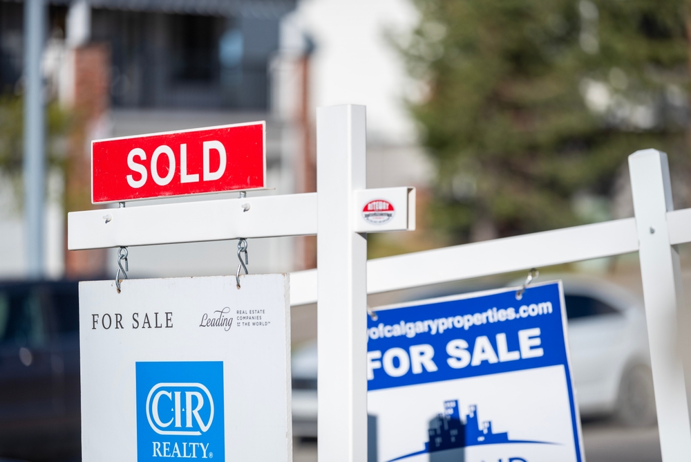 Calgary, Alberta, Canada - May 20th 2025: Real estate signs were photographed in a residential area.