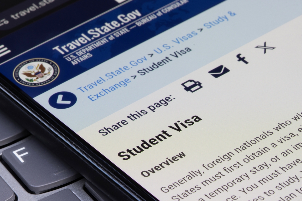 Portland, OR, USA - May 30, 2025: The U.S. Department of State's student visa page is seen on its official website on the screen of a smartphone.