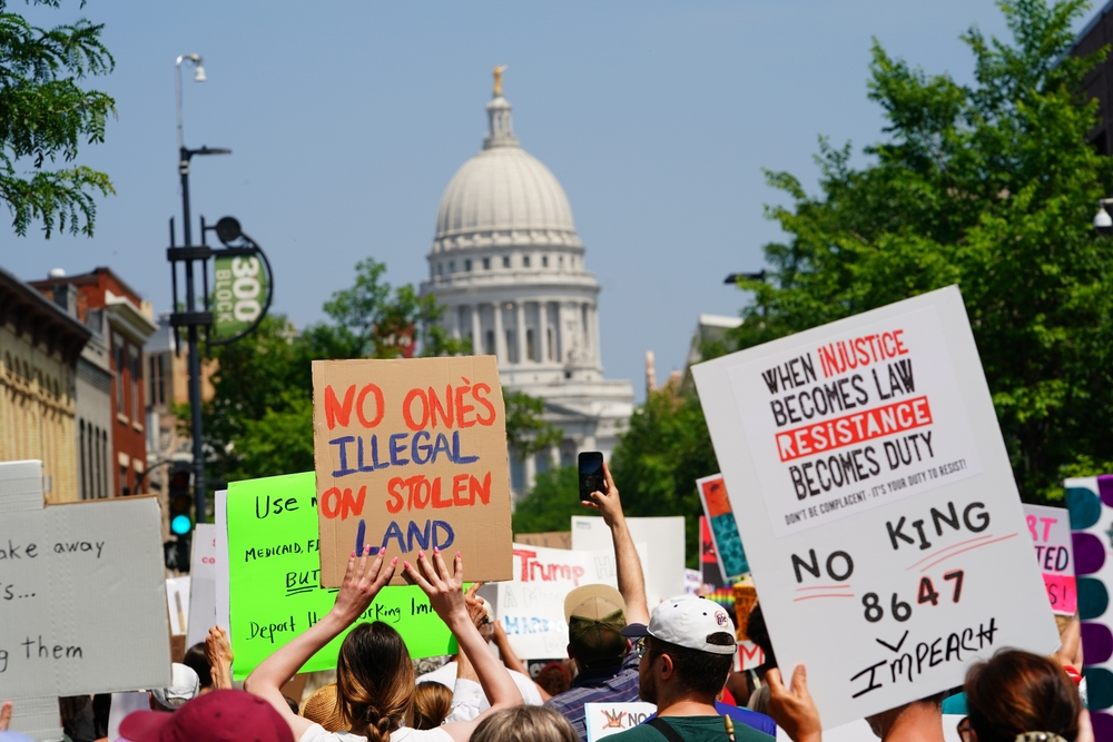 Madison, Wisconsin USA - June 14th, 2025: Mixed race people gathered together to protest during the No Kings event. 