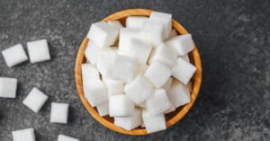 Popular Sugar Substitute Linked to Potential Risks to Brain Barrier in Lab Study sugar cubes in a bowl