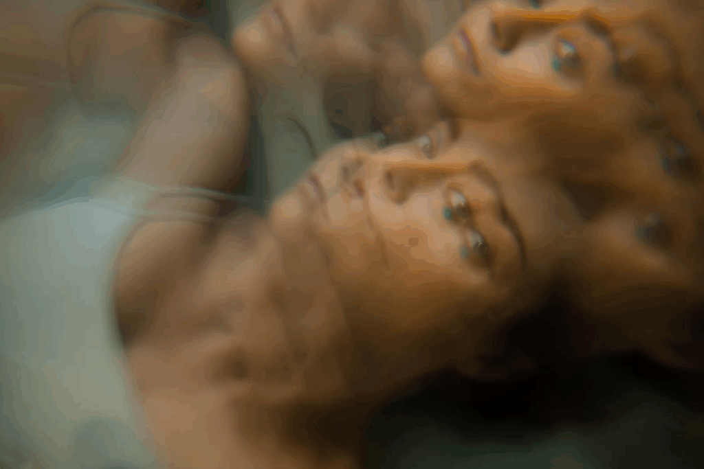 A Woman Lying Wearing White Spaghetti Strap Top
