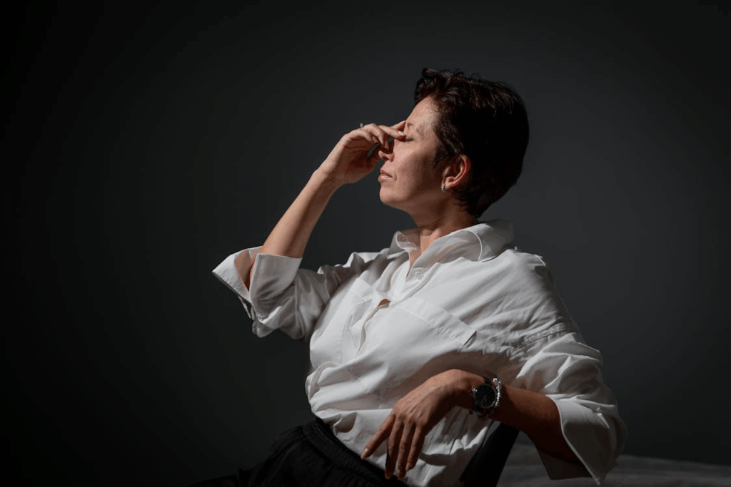 Thoughtful Woman in White Shirt Posing