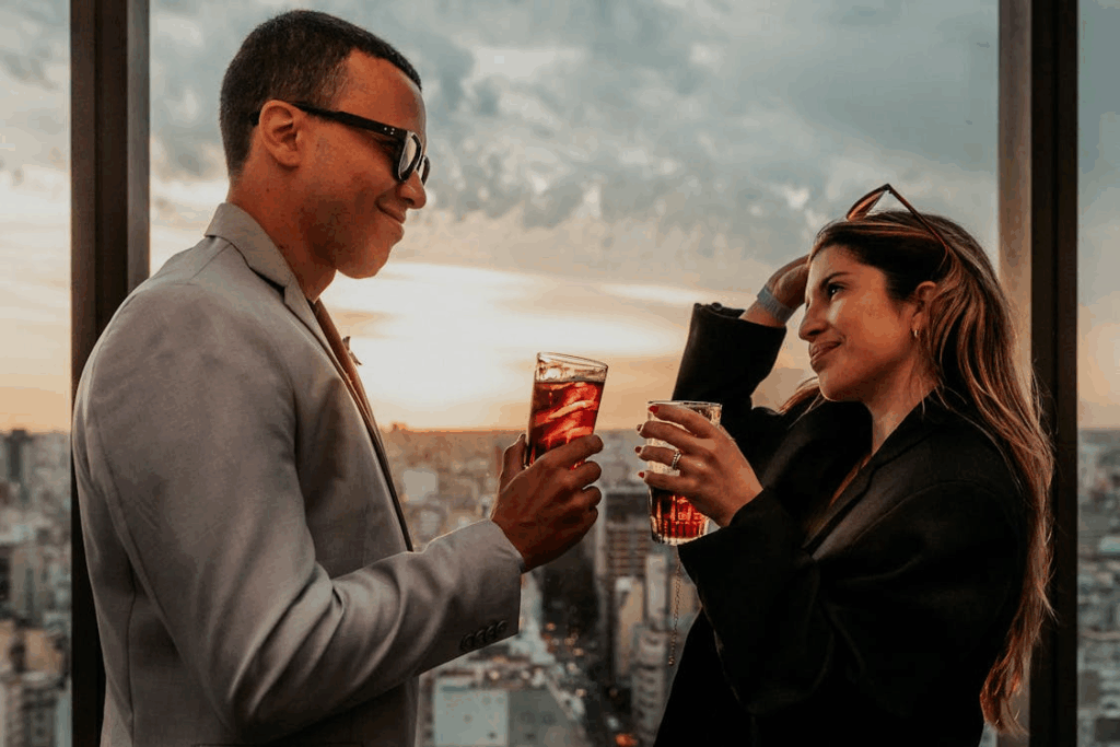 Stylish Conversation Over Drinks at Sunset