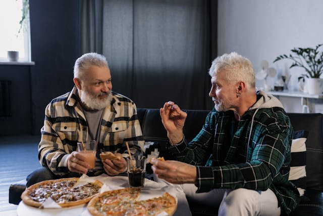 men eating pizza