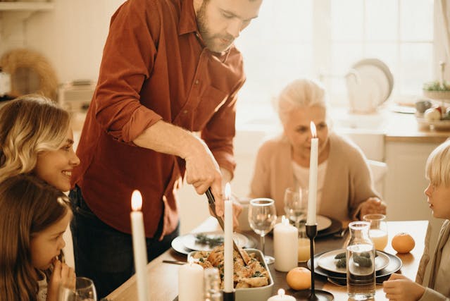 Man carving Christmas dinner