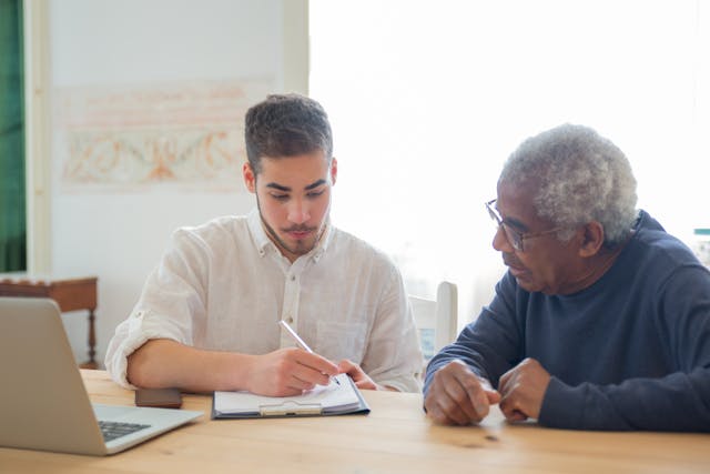 elderly patient talking to doctor