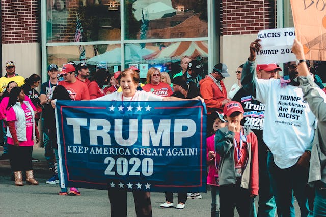 Woman holding a Trump sign