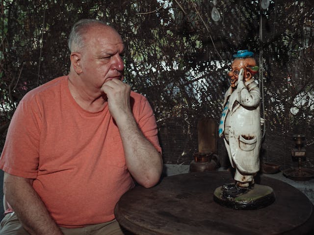 man looking at statue