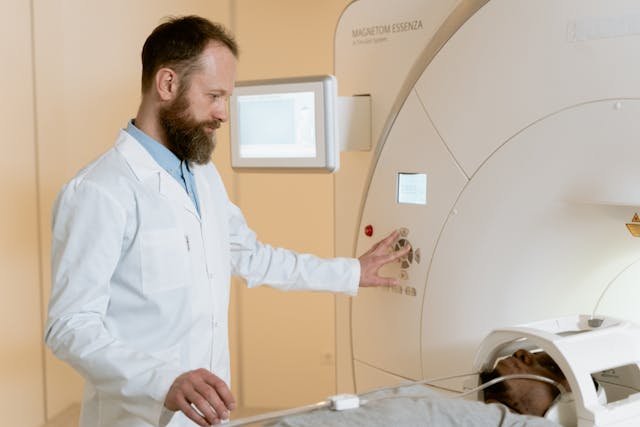 doctor assiting person in MRI