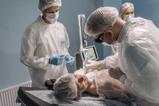 surgeons working on a man