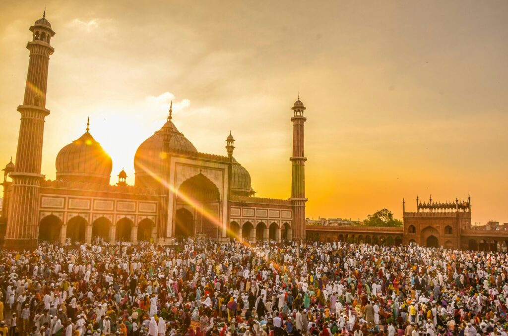 Photo Of People In Front Of Mosque During Golden Hour
