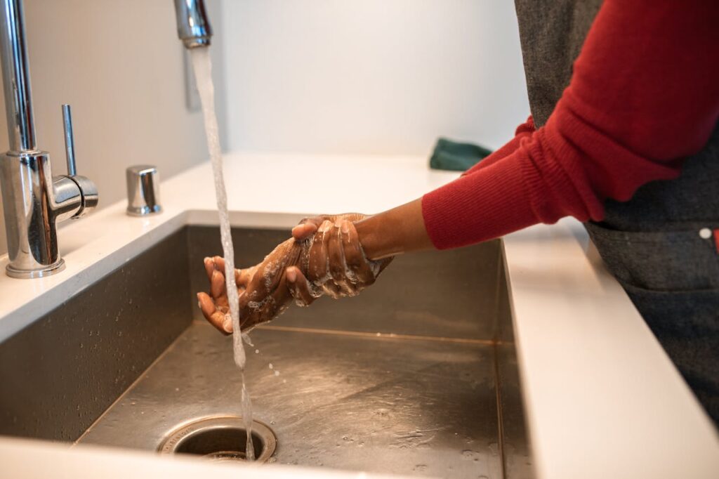 A Person Washing Hands
