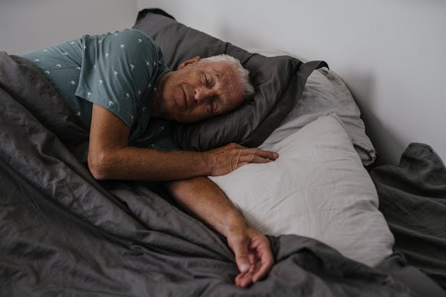man sleeping in bed