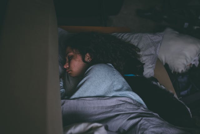 teen asleep in bed