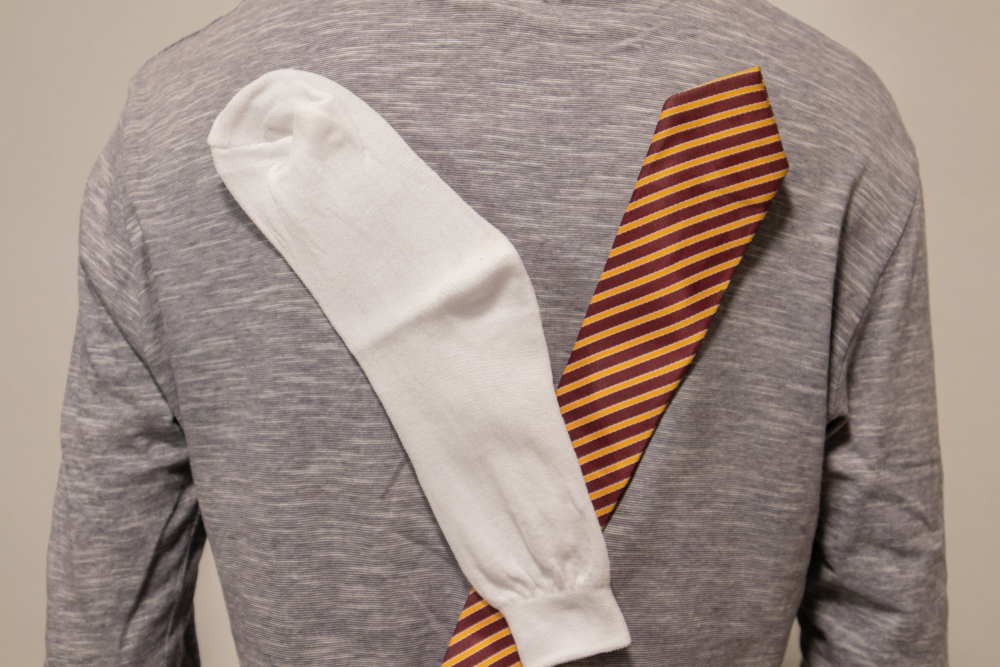 Due to Static Cling socks and tie sticked or attracted to tshirt.