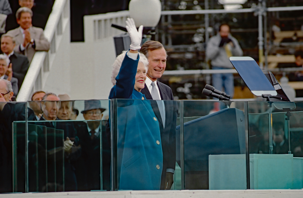 Washington DC, USA, January 20, 1989
Newly sworn in as the 41st President of the United States George H.W.Bush and First Lady Barbara Bush wave from behind the bullet proof glass of the podium